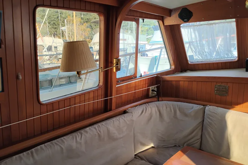 Slide: The Image of Interior of 1988 Monk 36 Aft Cabin with wood paneling and cozy seating area. - 29