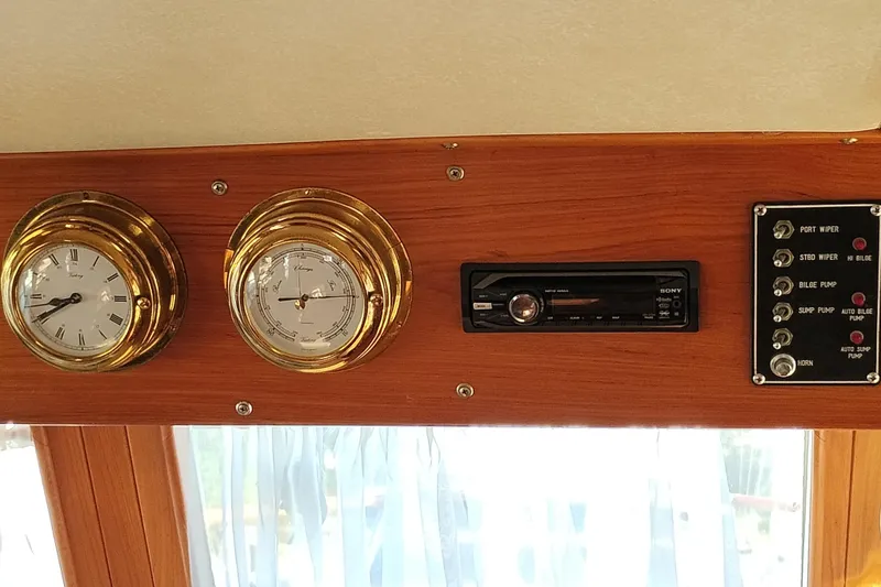Slide: The Image of Control panel of 1988 Monk 36 Aft Cabin with gauges and stereo system. - 33