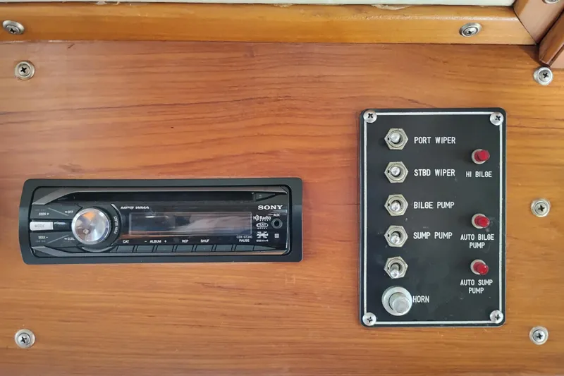 Slide: The Image of Control panel and stereo system on 1988 Monk 36 Aft Cabin boat. - 34