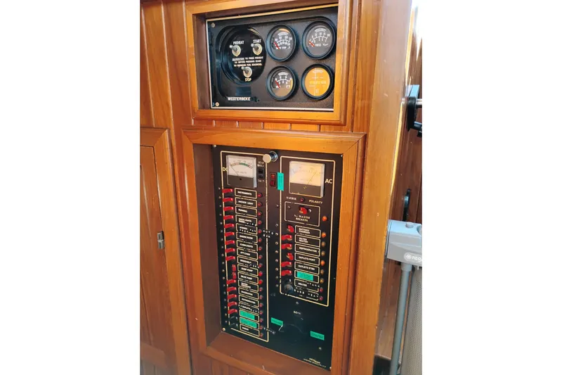 Slide: The Image of Electrical panel of 1988 Monk 36 Aft Cabin boat with gauges and switches. - 36