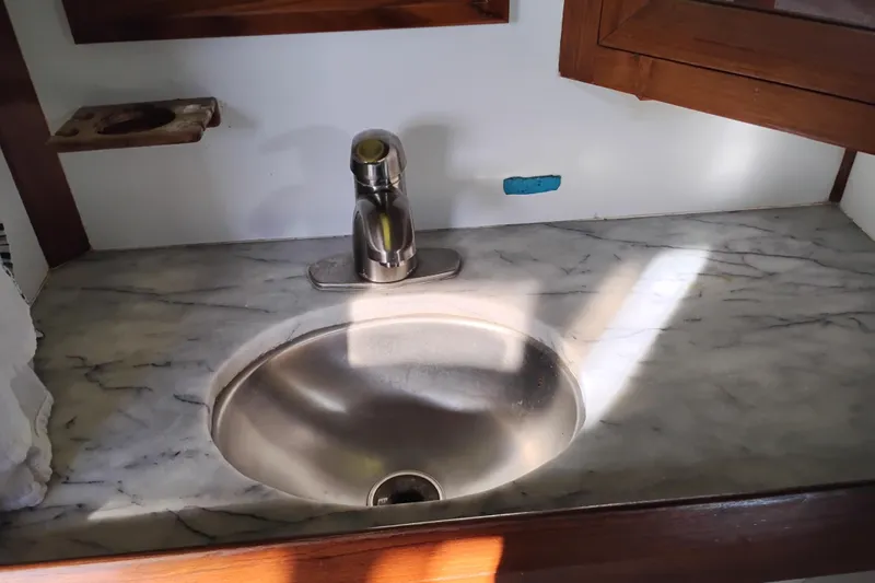 Slide: The Image of Stainless steel sink with marble countertop in 1988 Monk 36 Aft Cabin boat. - 52