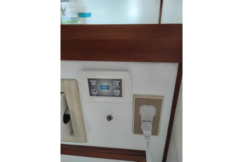 Slide: The Image of Control panel and outlet on 1988 Monk 36 Aft Cabin boat interior. - 55