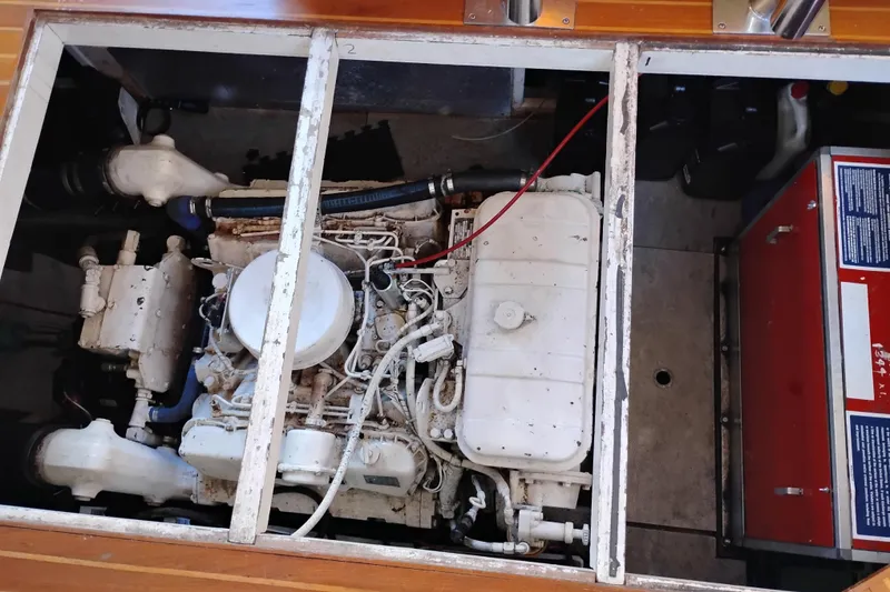 Slide: The Image of Engine compartment of a 1988 Monk 36 Aft Cabin boat, showcasing mechanical components. - 58
