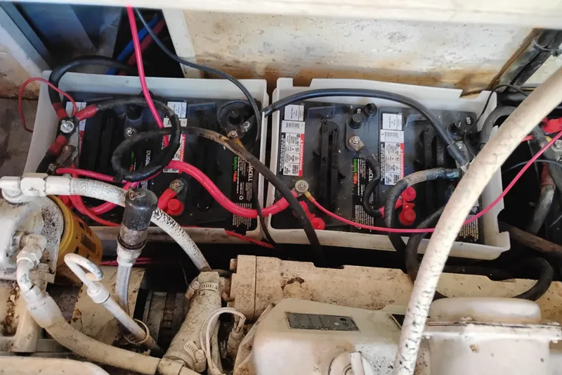 Slide: The Image of 1988 Monk 36 Aft Cabin engine compartment with batteries and wiring. - 60