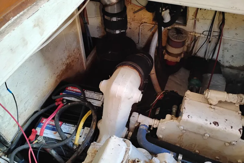 Slide: The Image of Engine room of 1988 Monk 36 Aft Cabin with batteries and mechanical components. - 61