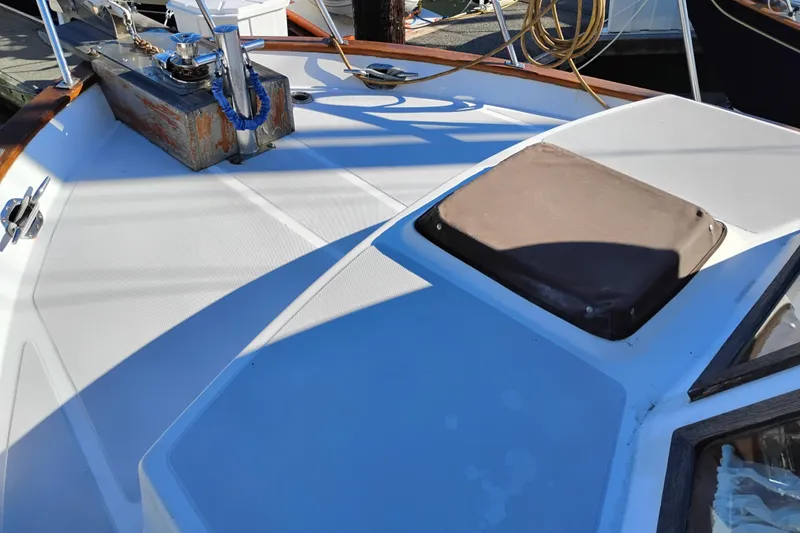 Slide: The Image of 1988 Monk 36 Aft Cabin boat deck with winch and hatch. - 64