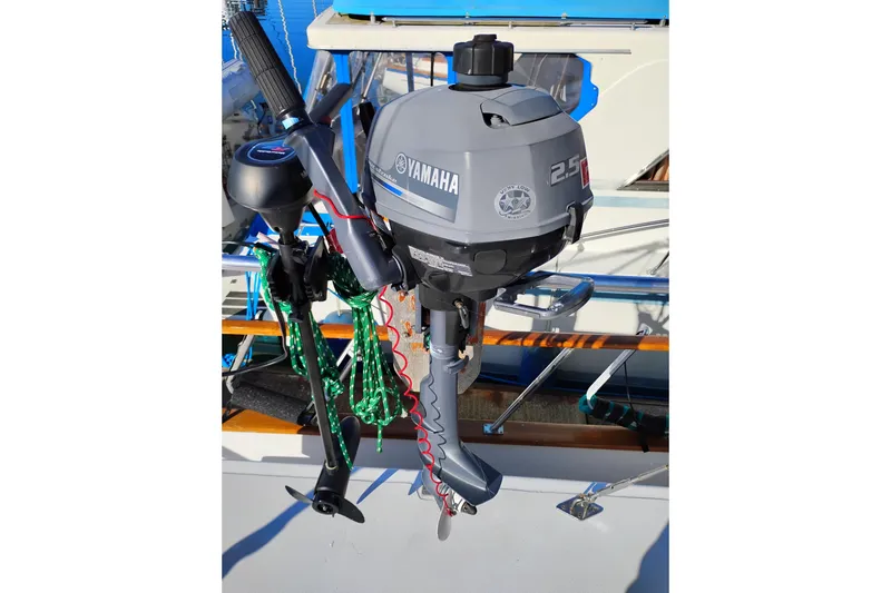 Slide: The Image of Yamaha 2.5 HP outboard motor mounted on 1988 Monk 36 Aft Cabin boat. - 67