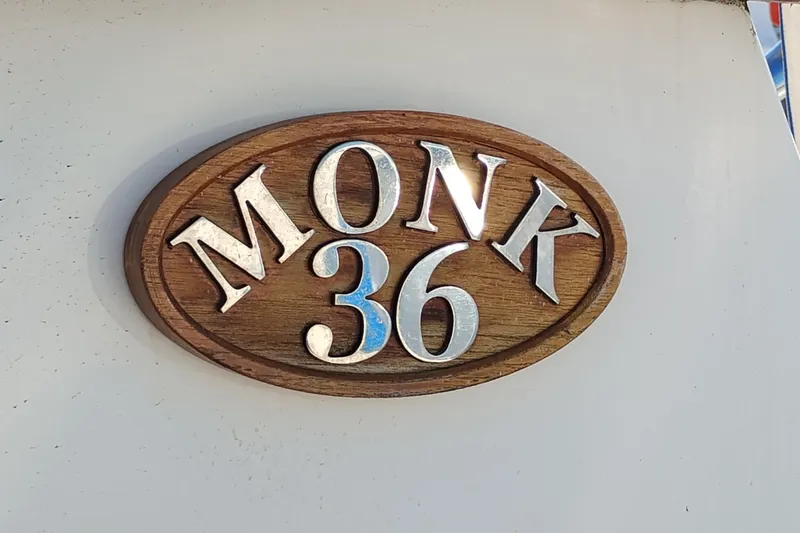 Slide: The Image of Monk 36 Aft Cabin 1988 wooden nameplate with metallic lettering. - 68