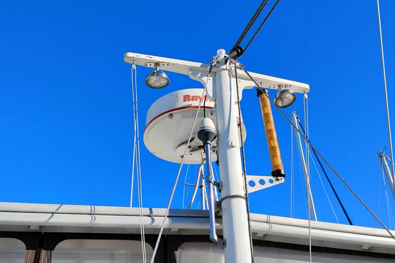 Slide: The Image of Radar and mast equipment on 1988 Monk 36 Aft Cabin boat against clear blue sky. - 7