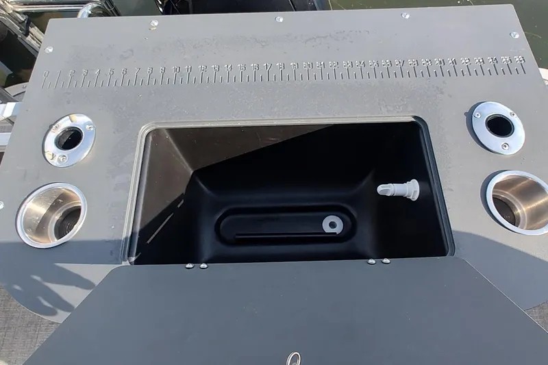 Slide: The Image of 2023 Tahoe Pontoon LTZ Entertainer with built-in fishing station and cup holders. - 4