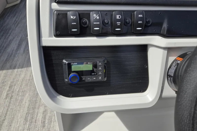 Slide: The Image of Control panel of 2026 Godfrey Sweetwater 2286 FS boat with Clarion audio system. - 17