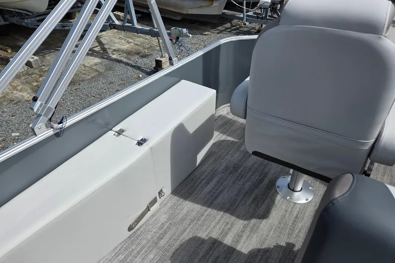 Slide: The Image of 2026 Godfrey Sweetwater 2286 FS boat interior with gray seating and carpeted flooring. - 21