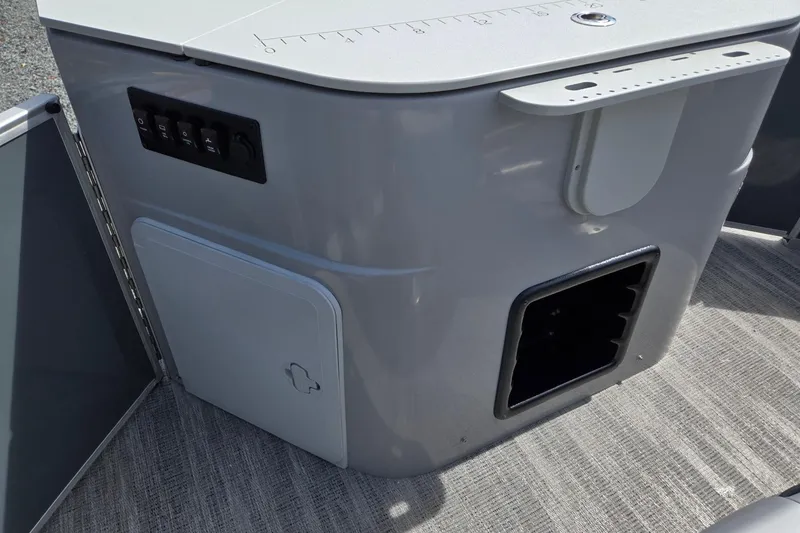 Slide: The Image of 2026 Godfrey Sweetwater 2286 FS boat interior with control panel and storage compartment. - 26