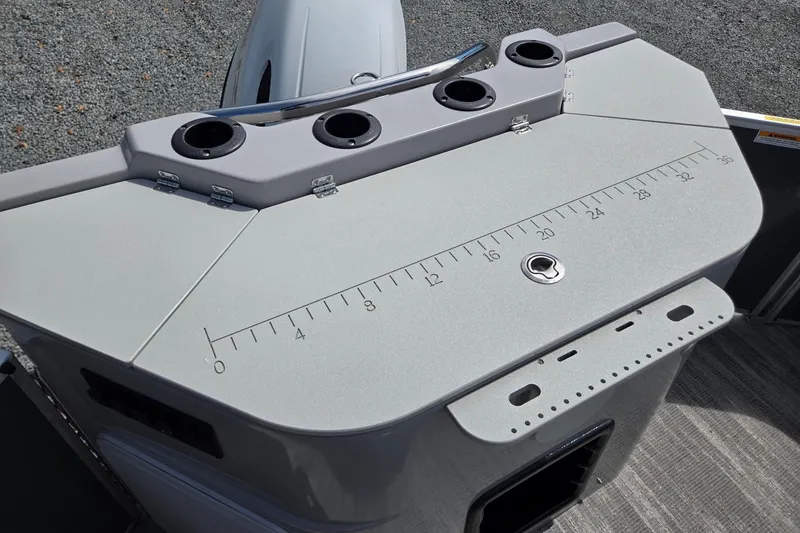 Slide: The Image of 2026 Godfrey Sweetwater 2286 FS boat console with cup holders and measurement markings. - 27