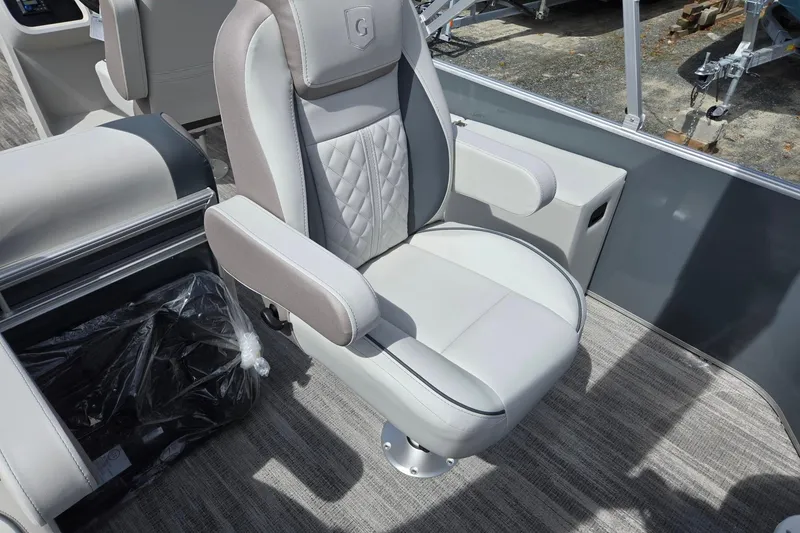 Slide: The Image of Captain's chair in 2026 Godfrey Sweetwater 2286 FS boat, featuring luxurious upholstery and armrests. - 33