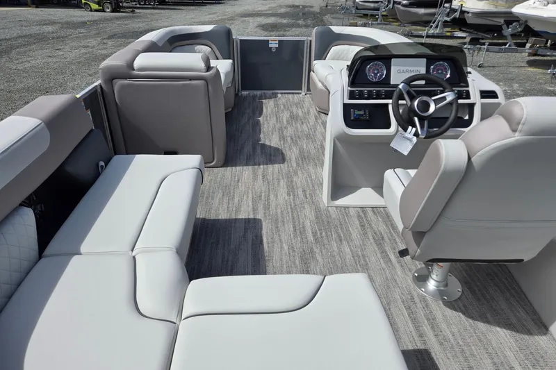 Slide: The Image of 2026 Godfrey Sweetwater 2286 FS pontoon boat interior with plush seating and modern dashboard. - 34