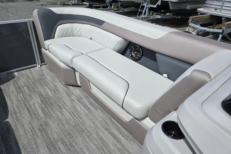 Slide: The Image of Luxurious seating on 2026 Godfrey Sweetwater 2286 FS pontoon boat, featuring elegant upholstery and speaker system. - 43