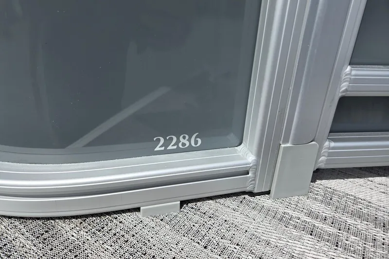 Slide: The Image of Close-up of Godfrey Sweetwater 2286 FS boat model, year 2026, with metallic detailing. - 48