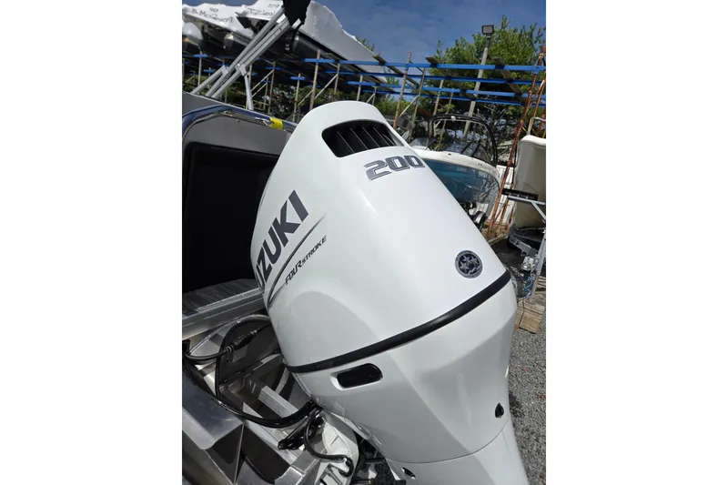 Slide: The Image of Suzuki 200 horsepower outboard motor on 2026 Godfrey Sweetwater 2286 FS boat. - 49