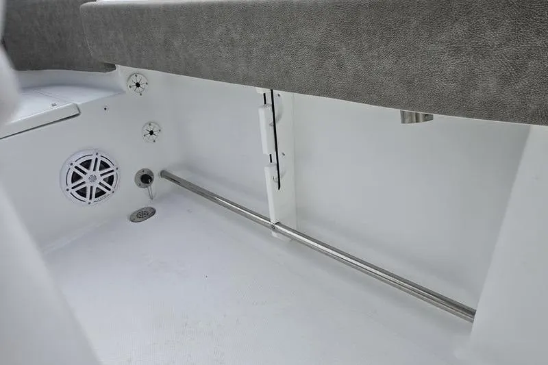 Slide: The Image of Interior view of 2026 Sea Hunt Ultra 229 boat, featuring seating and speaker. - 16
