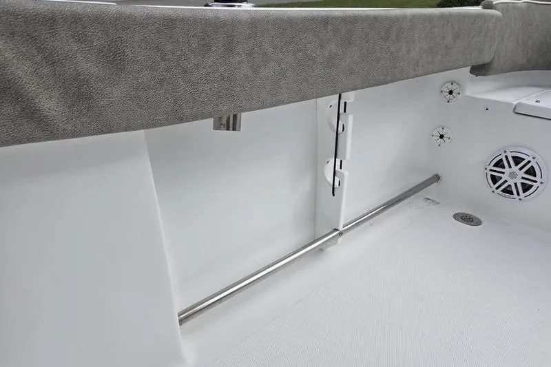Slide: The Image of 2026 Sea Hunt Ultra 229 boat interior with speaker and stainless steel railing. - 19
