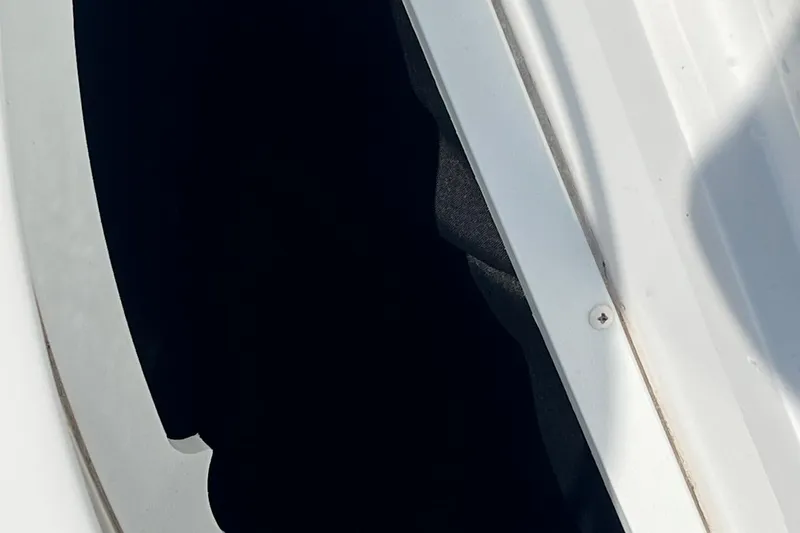 Slide: The Image of Close-up of a 2021 Hurricane SD 2486 boat hatch with white frame and dark interior. - 10