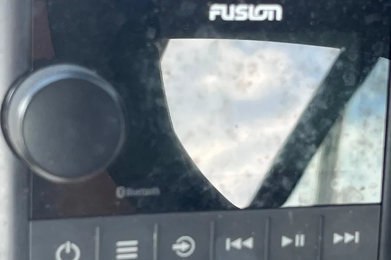 Slide: The Image of Close-up of a Fusion audio system in a 2021 Hurricane SD 2486 boat. - 16