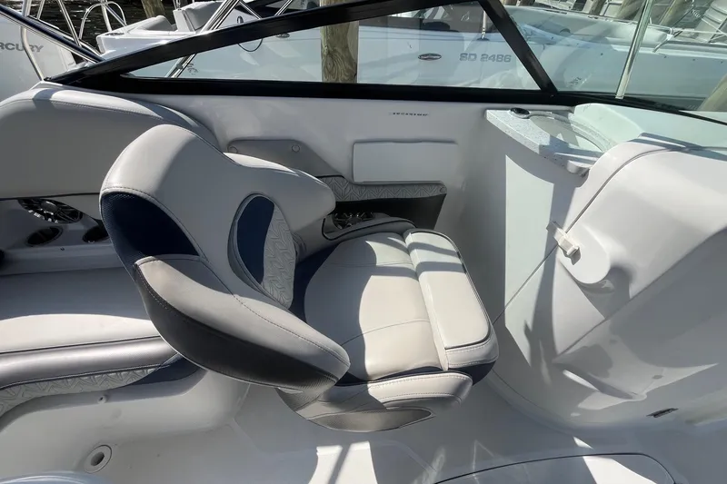 Slide: The Image of Interior of a 2021 Hurricane SD 2486 boat featuring a comfortable captain's chair. - 18