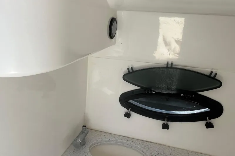 Slide: The Image of Interior of 2021 Hurricane SD 2486 boat with open porthole and sink. - 21