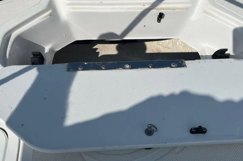 Slide: The Image of Open storage compartment on a 2021 Hurricane SD 2486 boat, showing interior details. - 25
