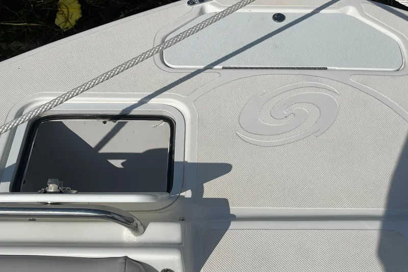 Slide: The Image of 2021 Hurricane SD 2486 boat deck with open hatch and rope detail. - 27