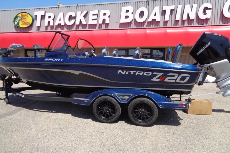 Slide: The Image of 2025 Nitro ZV20 Sport boat parked outside Tracker Boating Center. - 1