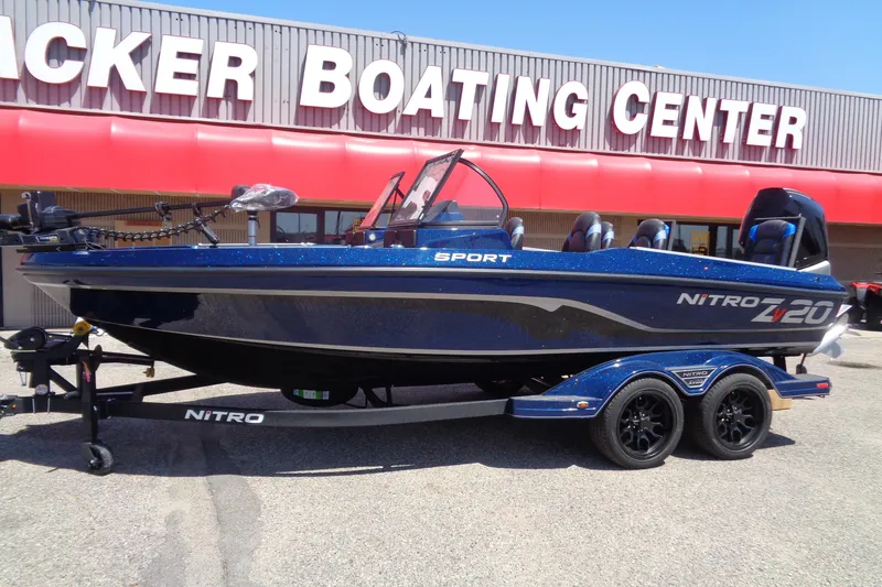 Slide: The Image of 2025 Nitro ZV20 Sport boat at Tracker Boating Center, blue exterior, on trailer. - 2