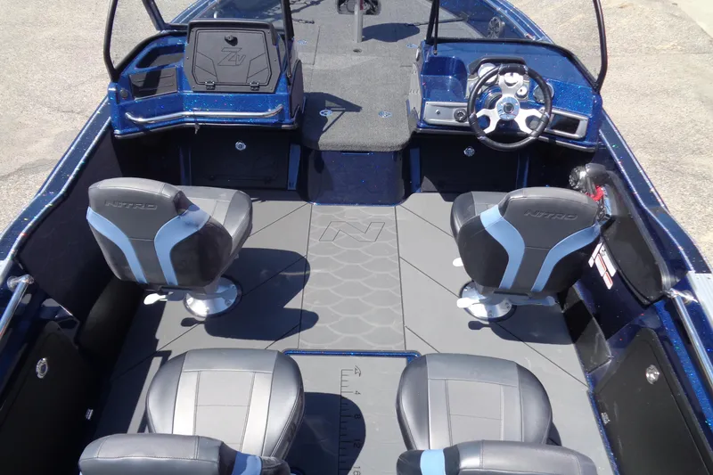 Slide: The Image of 2025 Nitro ZV20 Sport boat interior with four seats and steering wheel. - 6