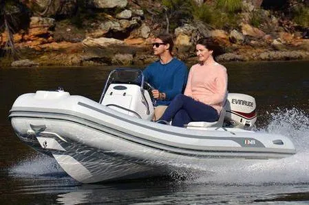Slide: The Image of 2024 AB Inflatables Oceanus 12 VST with Yamaha 40HP, cruising on water with two passengers. - 9