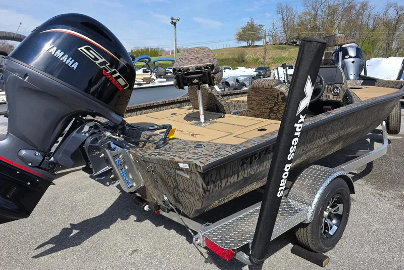 Slide: The Image of 2026 Xpress H18 Bass boat with Yamaha engine on a trailer. - 10