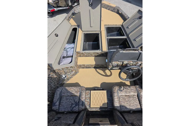 Slide: The Image of 2026 Xpress H18 Bass boat interior with camo seats and storage compartments. - 14
