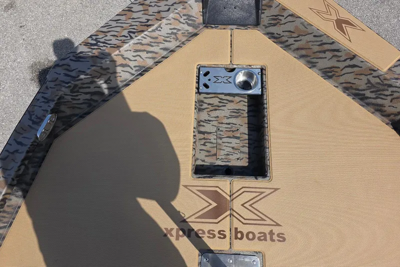 Slide: The Image of 2026 Xpress H18 Bass boat deck with camouflage pattern and logo. - 15