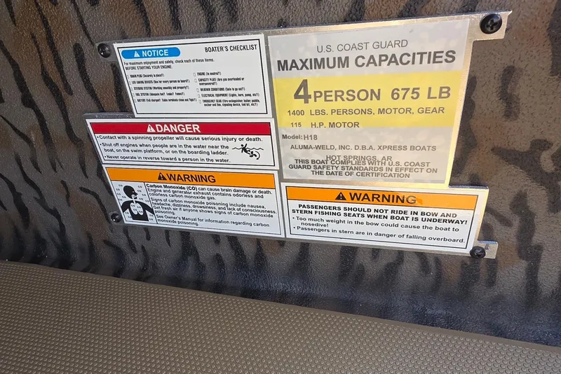 Slide: The Image of Safety warning labels on 2026 Xpress H18 Bass boat, detailing capacity and operational cautions. - 23
