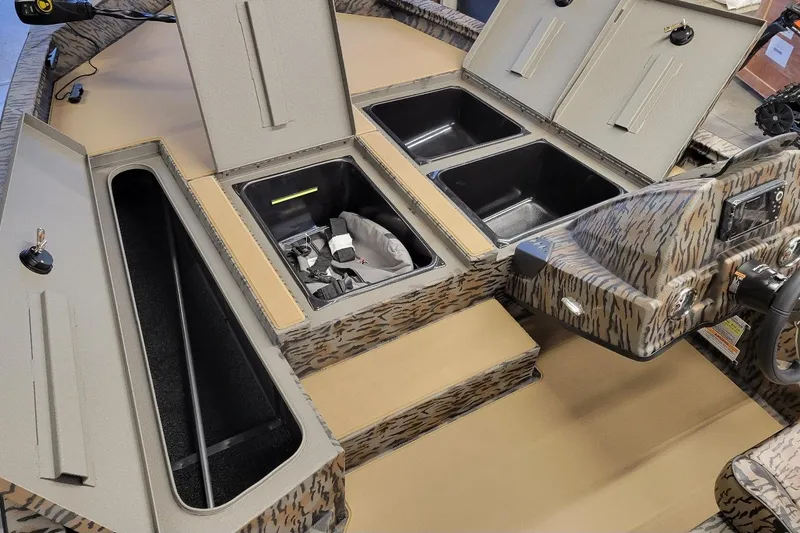 Slide: The Image of 2026 Xpress H18 Bass boat interior with storage compartments and control panel. - 6