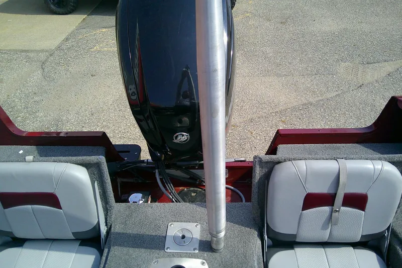 Slide: The Image of 2016 Tracker Pro Guide V-175 Combo boat interior with motor and seating. - 11