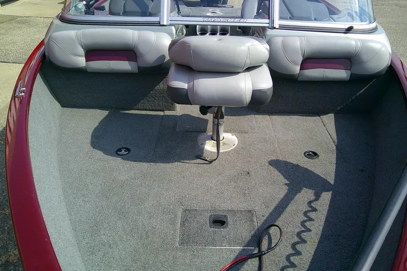 Slide: The Image of 2016 Tracker Pro Guide V-175 Combo boat interior with seating and carpeted floor. - 12