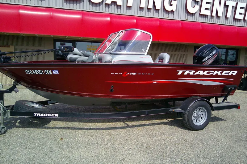 Slide: The Image of 2016 Tracker Pro Guide V-175 Combo boat on trailer outside boating center. - 3