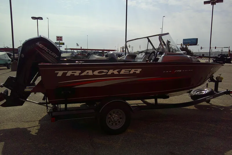 Slide: The Image of 2016 Tracker Pro Guide V-175 Combo boat on trailer in parking lot. - 4