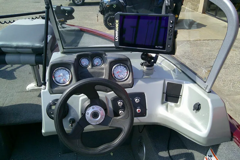 Slide: The Image of 2016 Tracker Pro Guide V-175 Combo boat dashboard with steering wheel and Lowrance Elite fishfinder. - 8