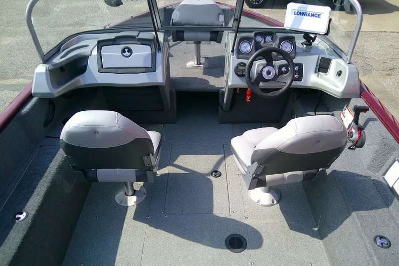 Slide: The Image of 2016 Tracker Pro Guide V-175 Combo boat interior with steering console and seating. - 9