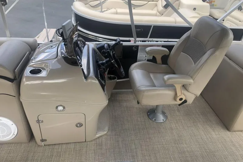 Slide: The Image of 2018 South Bay 822 CR boat interior with captain's chair and control console. - 4