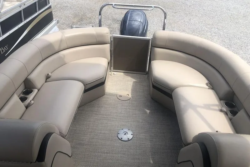 Slide: The Image of 2018 South Bay 822 CR boat interior with beige seating and cup holders. - 5