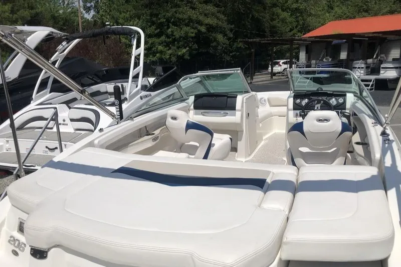 Slide: The Image of Interior of a 2011 Chaparral 206 SSi boat with white seating and steering console. - 4