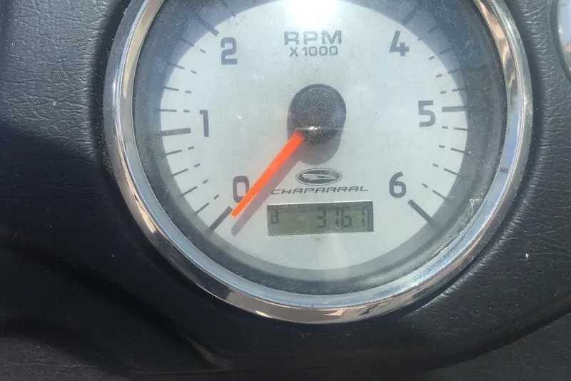 Slide: The Image of 2011 Chaparral 206 SSi boat interior with steering wheel and dashboard controls. - 6